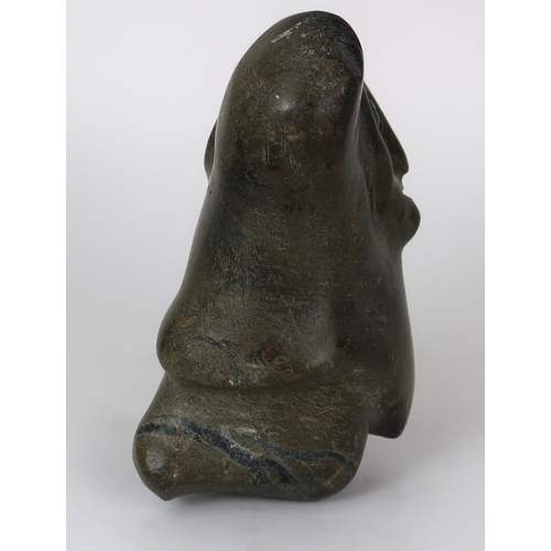 2952 - A 20TH CENTURY INUIT SOAPSTONE CARVING OF A FIGURE WITH HANDS ALOFT20.5cm high (8