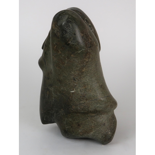 2952 - A 20TH CENTURY INUIT SOAPSTONE CARVING OF A FIGURE WITH HANDS ALOFT20.5cm high (8