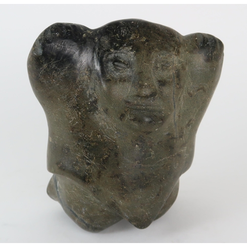 2952 - A 20TH CENTURY INUIT SOAPSTONE CARVING OF A FIGURE WITH HANDS ALOFT20.5cm high (8