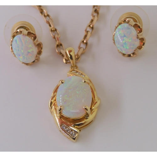 2792 - AN 18CT GOLD OPAL & DIAMOND PENDANTset with a 14mm x 9.8mm solid white opal, and diamond accents... 