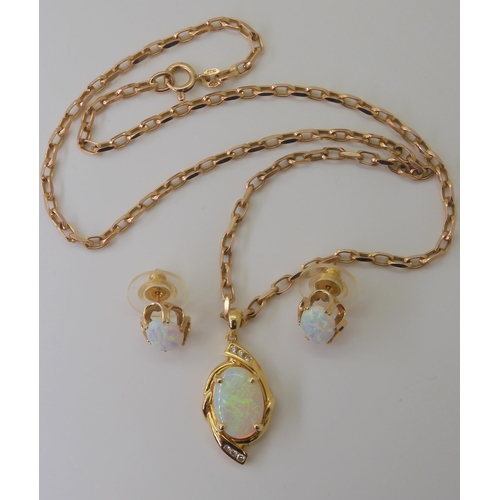 2792 - AN 18CT GOLD OPAL & DIAMOND PENDANTset with a 14mm x 9.8mm solid white opal, and diamond accents... 