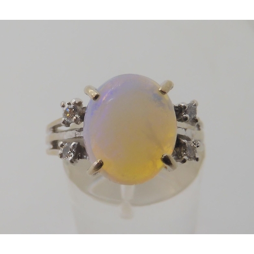 2797 - AN OPAL AND DIAMOND RINGmounted throughout in 18ct white gold, the oval opal is approx 11.3mm x 9.4m... 