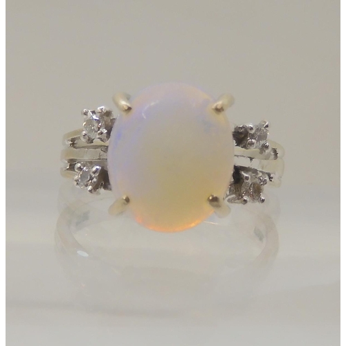 2797 - AN OPAL AND DIAMOND RINGmounted throughout in 18ct white gold, the oval opal is approx 11.3mm x 9.4m... 