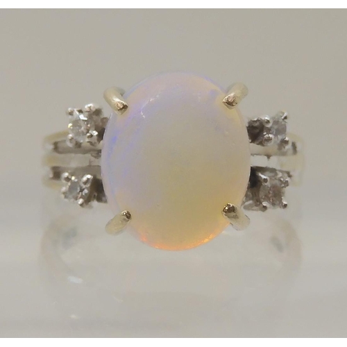 2797 - AN OPAL AND DIAMOND RINGmounted throughout in 18ct white gold, the oval opal is approx 11.3mm x 9.4m... 