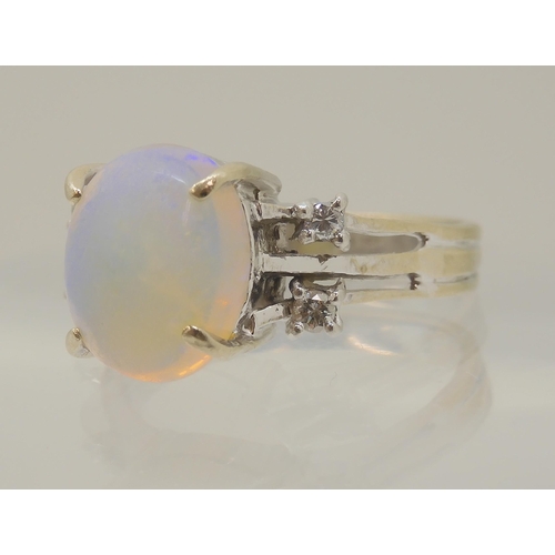 2797 - AN OPAL AND DIAMOND RINGmounted throughout in 18ct white gold, the oval opal is approx 11.3mm x 9.4m... 