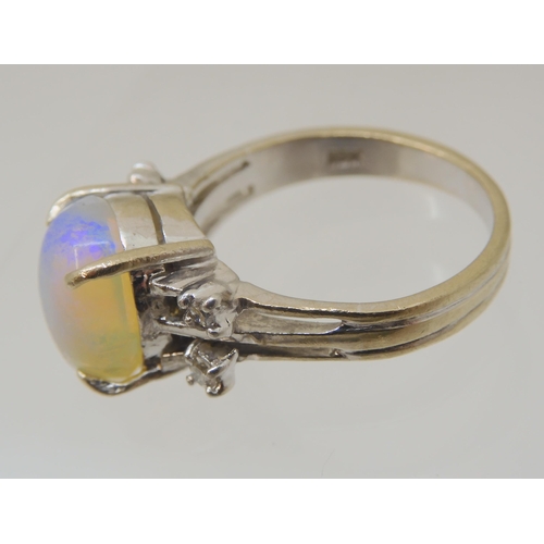 2797 - AN OPAL AND DIAMOND RINGmounted throughout in 18ct white gold, the oval opal is approx 11.3mm x 9.4m... 