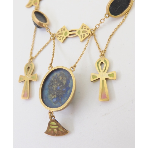 2802 - AN EGYPTIAN REVIVAL NECKLACEmade in gilded white metal, with plique a jour enamel ankhs and lotus fl... 