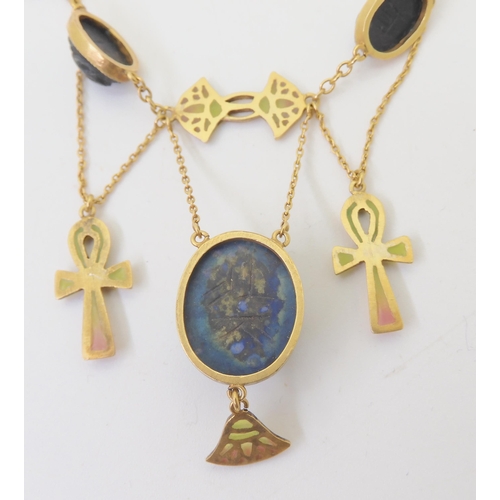 2802 - AN EGYPTIAN REVIVAL NECKLACEmade in gilded white metal, with plique a jour enamel ankhs and lotus fl... 