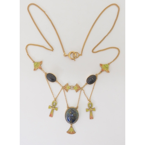 2802 - AN EGYPTIAN REVIVAL NECKLACEmade in gilded white metal, with plique a jour enamel ankhs and lotus fl... 