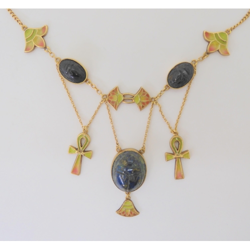 2802 - AN EGYPTIAN REVIVAL NECKLACEmade in gilded white metal, with plique a jour enamel ankhs and lotus fl... 