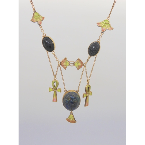 2802 - AN EGYPTIAN REVIVAL NECKLACEmade in gilded white metal, with plique a jour enamel ankhs and lotus fl... 