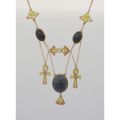 2802 - AN EGYPTIAN REVIVAL NECKLACEmade in gilded white metal, with plique a jour enamel ankhs and lotus fl... 