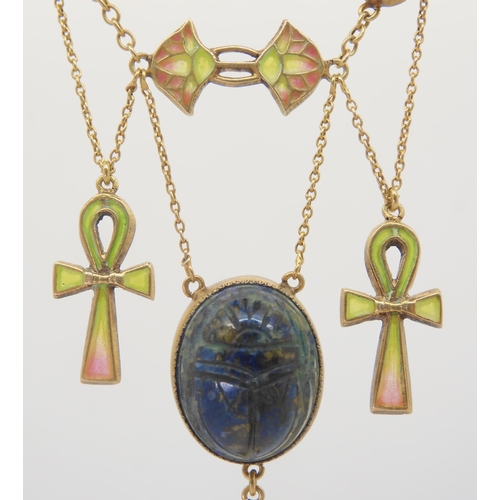 2802 - AN EGYPTIAN REVIVAL NECKLACEmade in gilded white metal, with plique a jour enamel ankhs and lotus fl... 