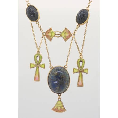 2802 - AN EGYPTIAN REVIVAL NECKLACEmade in gilded white metal, with plique a jour enamel ankhs and lotus fl... 