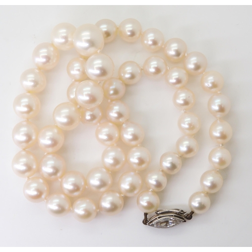 2760 - PEARLS WITH A MARQUIS DIAMOND CLASPthe pearls with a good lustre taper in size from 9mm to 6.6mm, th... 