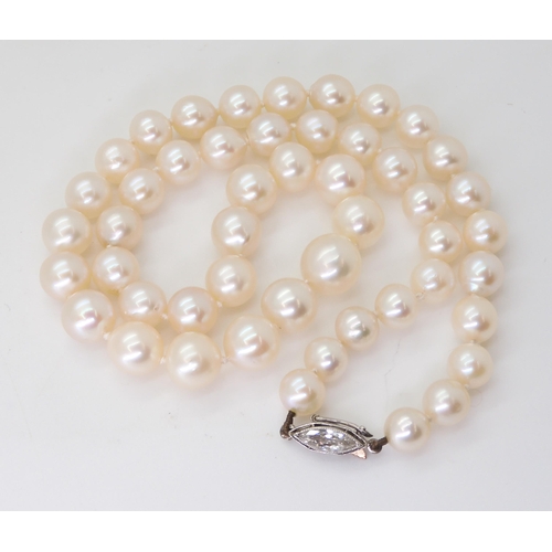 2760 - PEARLS WITH A MARQUIS DIAMOND CLASPthe pearls with a good lustre taper in size from 9mm to 6.6mm, th... 