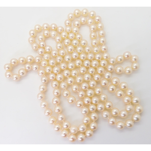 2762 - A CONTINUOUS ROPE LENGTH OF PEARLSeach cream pearl is approx 6.7mm, and the total length is approx 1... 