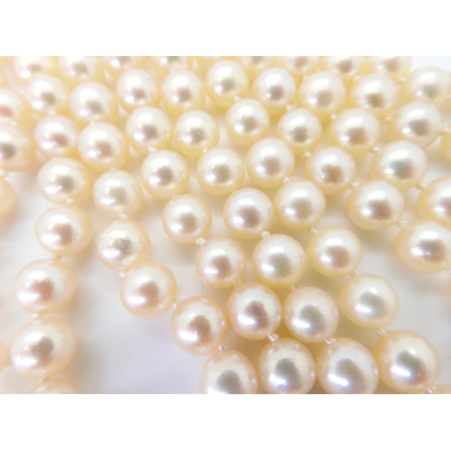 2762 - A CONTINUOUS ROPE LENGTH OF PEARLSeach cream pearl is approx 6.7mm, and the total length is approx 1... 