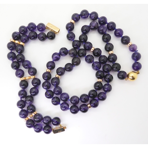 2764 - A STRING OF LARGE AMETHYST BEADSeach bead is approx 11mm, interspaced at intervals with 9ct barrel b... 