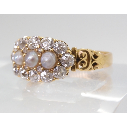 2765 - A PEARL AND OLD CUT DIAMOND RINGwith a pretty pierced gallery and shoulders in 18ct gold, set with e... 