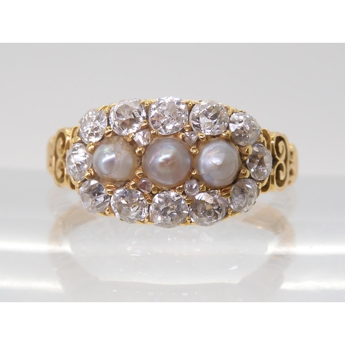 2765 - A PEARL AND OLD CUT DIAMOND RINGwith a pretty pierced gallery and shoulders in 18ct gold, set with e... 