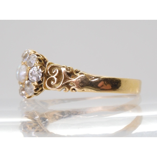 2765 - A PEARL AND OLD CUT DIAMOND RINGwith a pretty pierced gallery and shoulders in 18ct gold, set with e... 