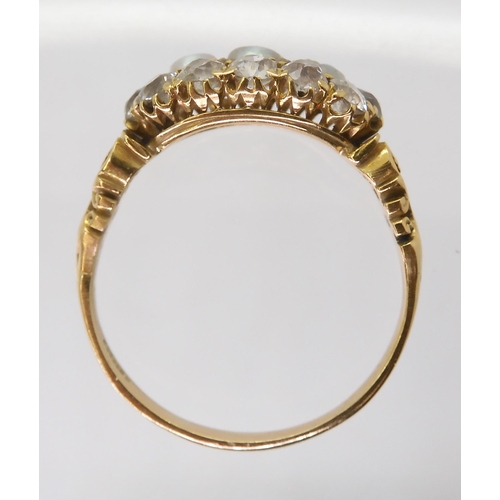 2765 - A PEARL AND OLD CUT DIAMOND RINGwith a pretty pierced gallery and shoulders in 18ct gold, set with e... 