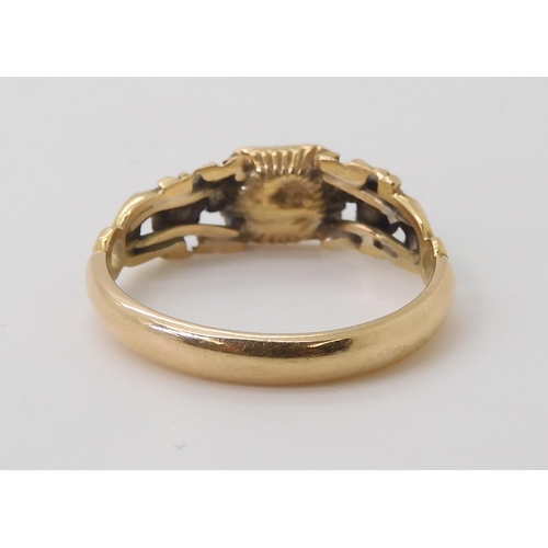 2766 - A GEORGIAN STYLE RINGmounted in yellow metal set with a red gem and rose cut diamonds, finger size a... 