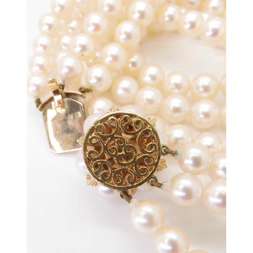 2767 - AN 18CT GOLD PEARL AND DIAMOND PEARL CLASPfor a three-string pearl collar. Each pearl of approx 6.9m... 