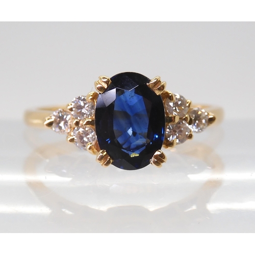 2768 - A FRENCH SAPPHIRE & DIAMOND RINGset with an 8mm x 5.8mm x 3.4mm, the shoulders are set with thre... 