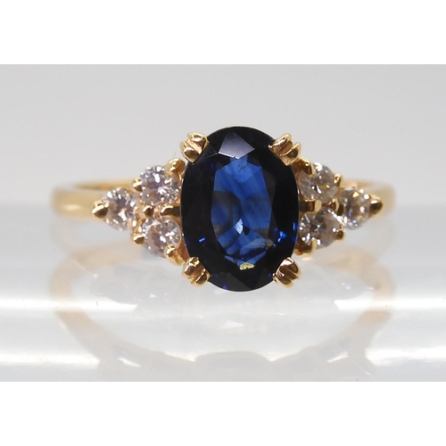 2768 - A FRENCH SAPPHIRE & DIAMOND RINGset with an 8mm x 5.8mm x 3.4mm, the shoulders are set with thre... 