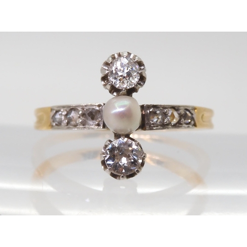 2770 - A VINTAGE DIAMOND & PEARL RINGthe twin diamonds are estimated approx 0.30cts combined, with furt... 