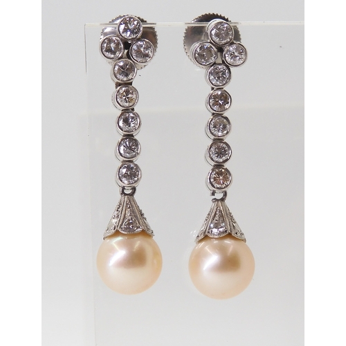 2774 - DIAMOND & PEARL DROP EARRINGSeach cream pearl measures approx 8mm, set into a diamond set engrav... 