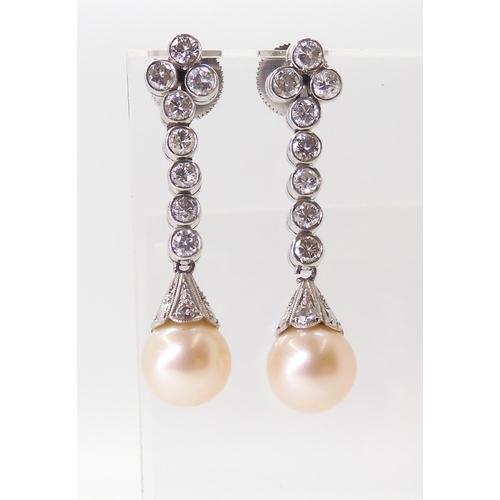 2774 - DIAMOND & PEARL DROP EARRINGSeach cream pearl measures approx 8mm, set into a diamond set engrav... 