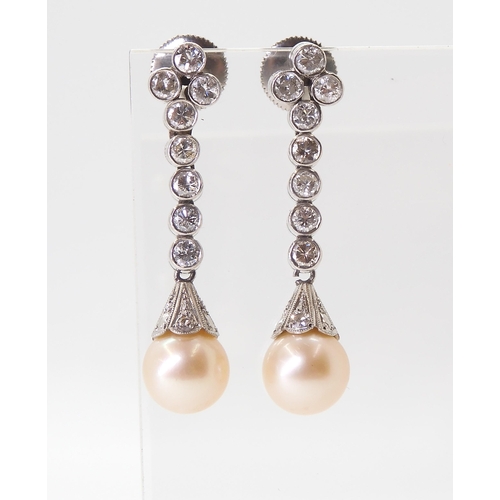 2774 - DIAMOND & PEARL DROP EARRINGSeach cream pearl measures approx 8mm, set into a diamond set engrav... 