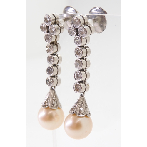 2774 - DIAMOND & PEARL DROP EARRINGSeach cream pearl measures approx 8mm, set into a diamond set engrav... 