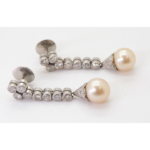 2774 - DIAMOND & PEARL DROP EARRINGSeach cream pearl measures approx 8mm, set into a diamond set engrav... 