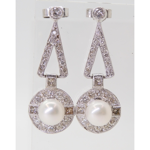 2780 - A PAIR OF DIAMOND & PEARL EARRINGSthe white pearls are approximately 6.4mm and surrounded with p... 