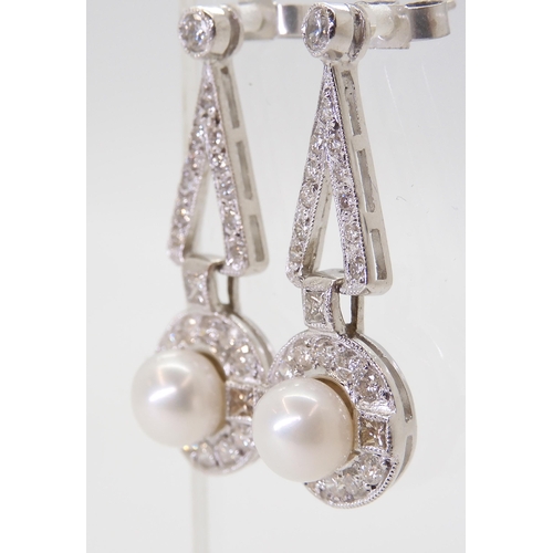 2780 - A PAIR OF DIAMOND & PEARL EARRINGSthe white pearls are approximately 6.4mm and surrounded with p... 