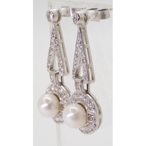 2780 - A PAIR OF DIAMOND & PEARL EARRINGSthe white pearls are approximately 6.4mm and surrounded with p... 