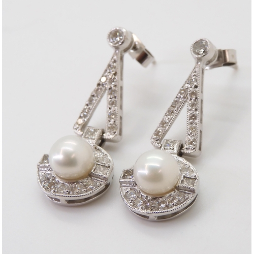 2780 - A PAIR OF DIAMOND & PEARL EARRINGSthe white pearls are approximately 6.4mm and surrounded with p... 