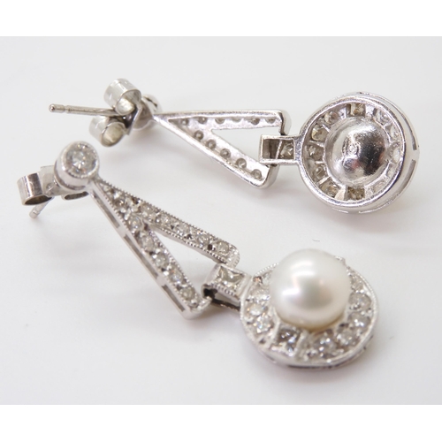 2780 - A PAIR OF DIAMOND & PEARL EARRINGSthe white pearls are approximately 6.4mm and surrounded with p... 