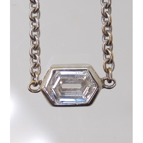 2781 - A DIAMOND SOLITAIRE PENDANTset with an unusual octagonal cut diamond with an estimated approx carat ... 