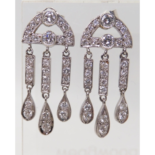 2786 - 18CT WHITE GOLD DIAMOND EARRINGSwith three pendant drops, set throughout with brilliant cut diamonds... 