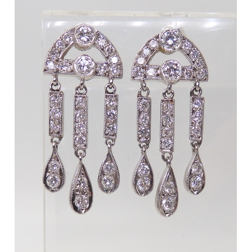 2786 - 18CT WHITE GOLD DIAMOND EARRINGSwith three pendant drops, set throughout with brilliant cut diamonds... 