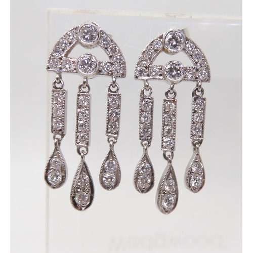 2786 - 18CT WHITE GOLD DIAMOND EARRINGSwith three pendant drops, set throughout with brilliant cut diamonds... 