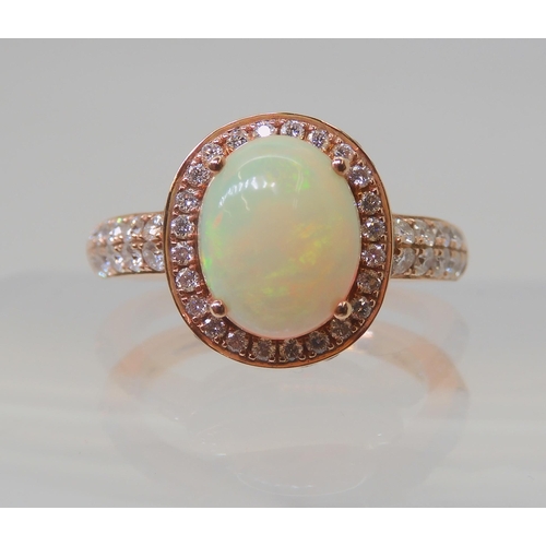 2816 - A LE VIAN OPAL & DIAMOND RINGmounted in 14k rose gold, and set with estimated approx 0.50cts of ... 