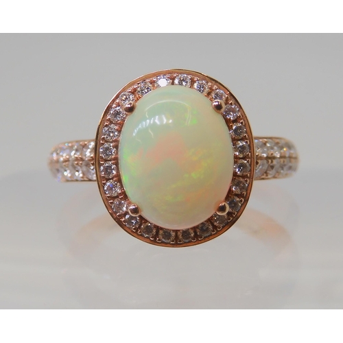 2816 - A LE VIAN OPAL & DIAMOND RINGmounted in 14k rose gold, and set with estimated approx 0.50cts of ... 