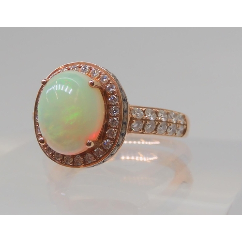 2816 - A LE VIAN OPAL & DIAMOND RINGmounted in 14k rose gold, and set with estimated approx 0.50cts of ... 