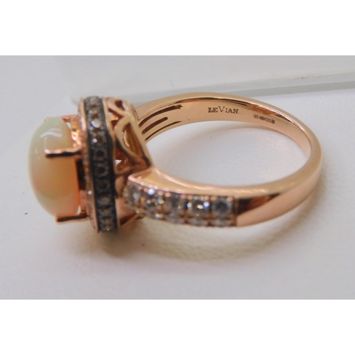 2816 - A LE VIAN OPAL & DIAMOND RINGmounted in 14k rose gold, and set with estimated approx 0.50cts of ... 